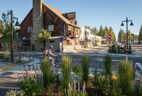 biker in front of housing